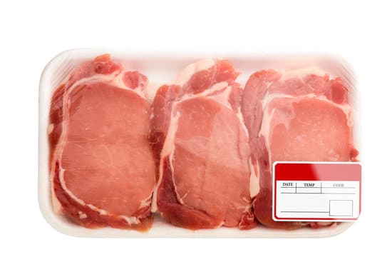 Fresh red meat packed in a poly bag. Isolated over white.
