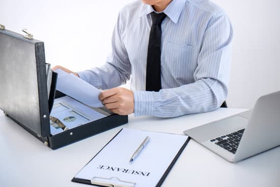 Insurance concept, businessman signing a car insurance policy.