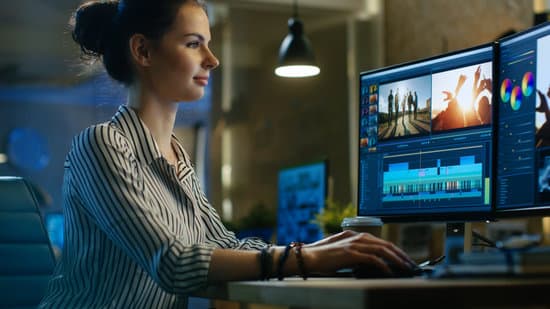 Beautiful Female Video Editor Works with Footage on Her Personal Computer, She Works in Creative Office Studio.
